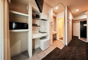 a small bathroom with a sink and a toilet at Moat Inside Tenjin in Fukuoka