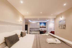 a large bedroom with a bed and a kitchen at Padam Hotel & SPA in Ulcinj +289 photos