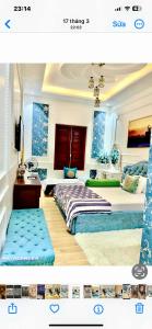 a bedroom with two beds and a tv in it at Luxury hotel t&l in Cẩm Phả