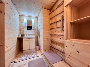 a bathroom with wooden walls and a sink and a counter at 瀬戸内海を望む庭付き古民家サウナ宿 一棟貸切 in Takamatsu +26 photos