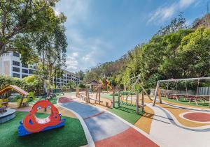 a park with a playground with a roller coaster at Le Méridien Xiamen in Xiamen