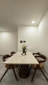 a meeting room with a table and chairs at CozyKey Kalina in Mumbai +14 photos