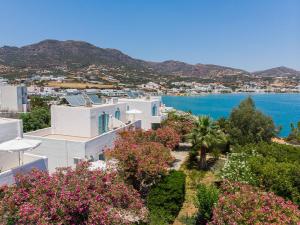 an aerial view of a city and the ocean at Makrigialos Apartments und Studios in Makry Gialos +29 photos