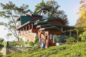a house on top of a hill at Udadola Ecolodge in Deniyaya