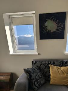 a living room with a window and a couch at Apartment Luna in Bovec
