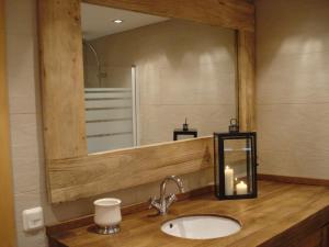 a bathroom with a sink and a large mirror at Petit Ours in Villars-sur-Ollon +37 photos