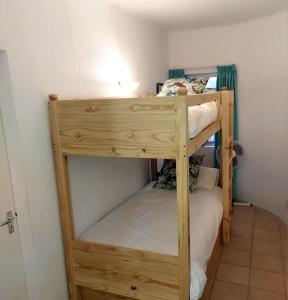 a bunk bed in a small room with a bunk bed in a room at Seaside haven in Simonʼs Town