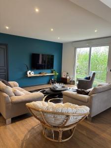 a living room with a couch and a table at la casa bella vista in Enval