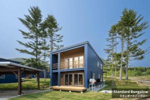 a house with a blue facade at Rusutsu Hills CENTRO in Rusutsu