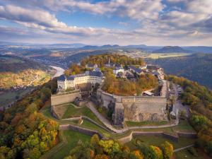 an aerial view of a castle in the hills at Königstein Hostel in Königstein an der Elbe