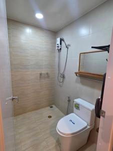 a bathroom with a shower and a toilet in it at Kanchana home stay กาญจนา โฮมสเตย์ สุราษฏร์ in Ban Bo Thong +34 photos