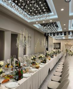 a long table with plates of food on it at Prince Hotel Kapan in Kapan