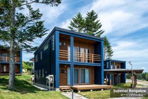 a house with a blue facade at Rusutsu Hills CENTRO in Rusutsu