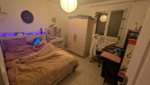 a small bedroom with a bed and a mirror at Quiet house in Aubagne +8 photos