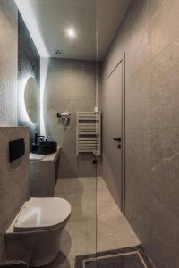 a bathroom with a toilet and a sink at Frourio Lodge B2 in Larisa +12 photos