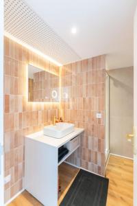 a bathroom with a sink and a mirror at Petit Levant in La Ciotat