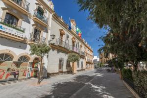 an empty street in a city with buildings at River Corner - Centro Ayamonte in Ayamonte