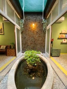 a building with a pond in the middle of a room at 光陰GUANGinn in Hsinchu City