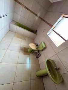 an overhead view of a bathroom with two toilets at BotseBontle Lodge in Lenting