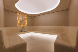 a bathroom with a tub with a round ceiling at Hotel Podgorie Spa in Bukovel