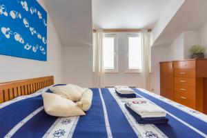 Postel nebo postele na pokoji v ubytování Apartment Hedera A14