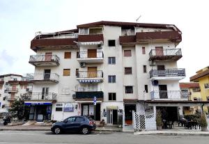 a car parked in front of a building at Appartamento Centrale Scalea in Scalea