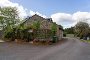 a house with a gate in the middle of a road at Alensgrove Maisonette C in Leixlip