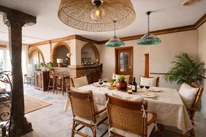 a dining room with a table with wine glasses at Villa Alma Boutique Sea View and Pool adults only in Benalmádena