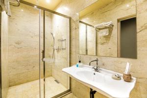 a bathroom with a sink and a shower at Art Club in Baku +39 photos