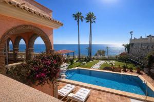 a swimming pool with a view of the ocean at Villa Alma Boutique Sea View and Pool adults only in Benalmádena