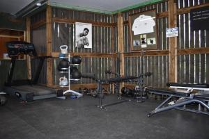 a gym with several exercise equipment in a room at Alensgrove Maisonette D in Leixlip