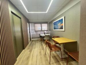 an office room with a table and chairs and a table and a table at Abacoa Life in Alicante +12 photos