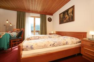 Ein Bett oder Betten in einem Zimmer der Unterkunft Pension Lacknerhof