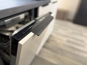 a close up of a remote control on an oven at Moderne Studio Wohnung in Stuttgart-Zentrum in Stuttgart +16 photos