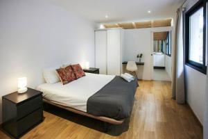 a bedroom with a bed and a large window at Casa Carmen in Alcanar +25 photos