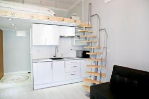 Kuchyň nebo kuchyňský kout v ubytování Elegant Studio Bonerowska