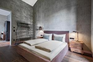 A bed or beds in a room at Senses Violett Suites - Adults Only