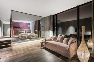 A bed or beds in a room at Senses Violett Suites - Adults Only