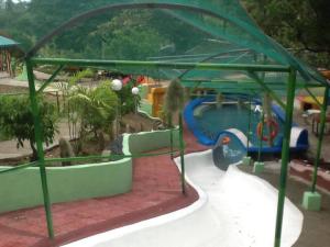 a playground with a water slide in a park at BuenaMaria Mountain Resort in Puerto Galera