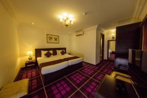 a hotel room with a bed and a television at The Steuart by Citrus in Colombo