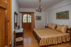 A bed or beds in a room at Petrinos Milos