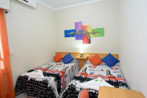 Postel nebo postele na pokoji v ubytování Hostal Carrizo