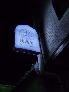 a sign for arw outside of a building at RAY Boutique Hotel withTerrace in Bukhara