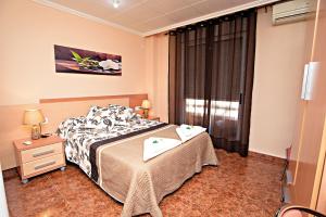 Postel nebo postele na pokoji v ubytování Hostal Carrizo