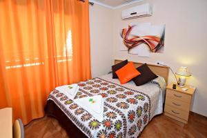 Postel nebo postele na pokoji v ubytování Hostal Carrizo