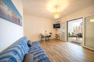 a living room with a couch and a table at La Dimora del Sole in Monopoli