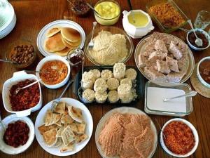 a table topped with lots of different types of food at Dream villa in Imaduwa