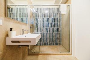 a bathroom with a sink and a shower at Crystal Camere in Marcelli +97 photos