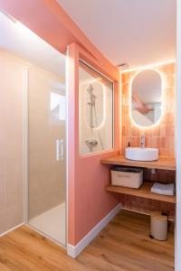 a bathroom with a shower and a sink at Lavagnou Duplex in La Ciotat