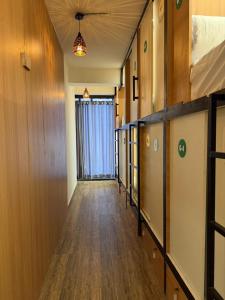 a hallway with wood floors and a ceiling at FarGo Hotels By Lowfare Hotels in Bangalore